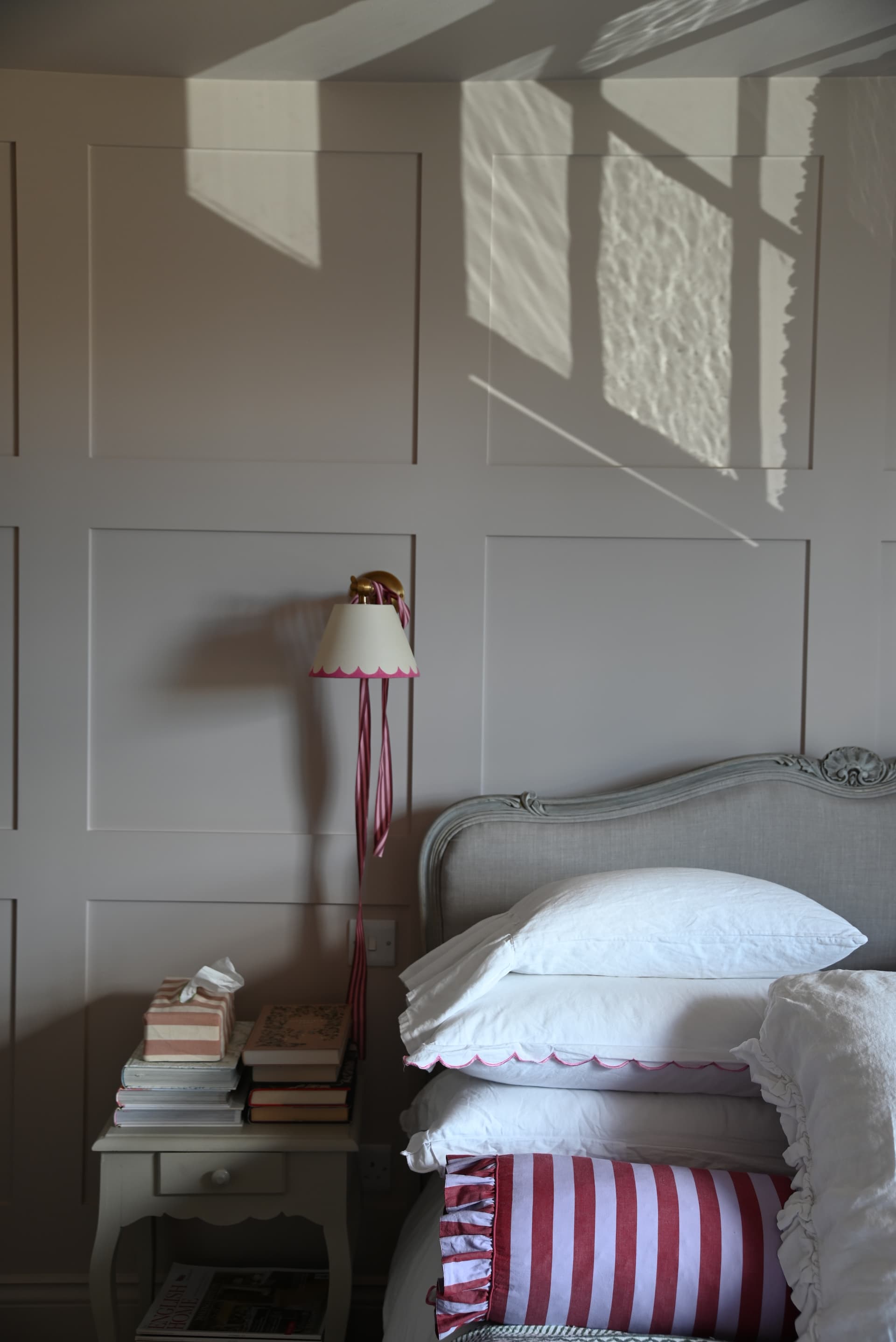 Bedroom — panelled wall with sconce light