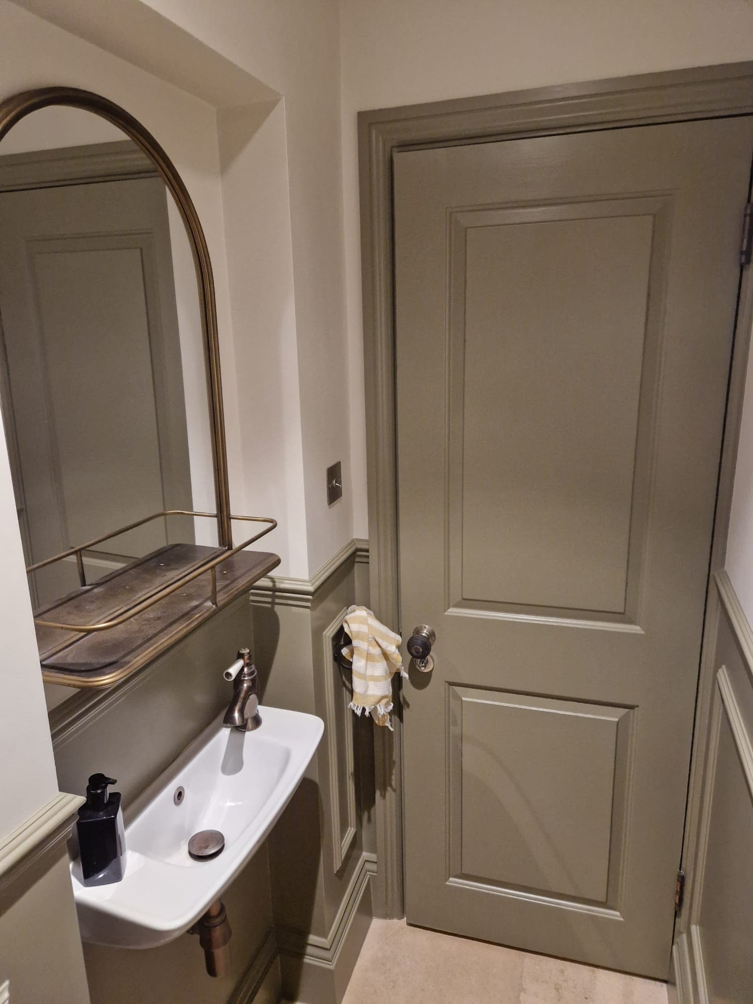 Cloakroom — sink & painted door detail